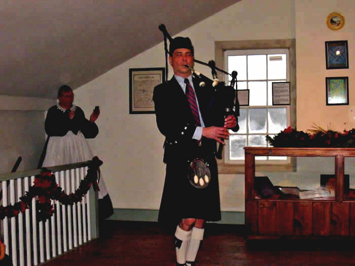 Robert McWilliams plays bagpipes in the Ballroom. 